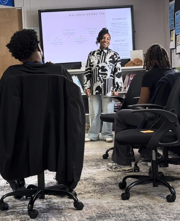 Ally facilitating a corporate wellness session for a professional team