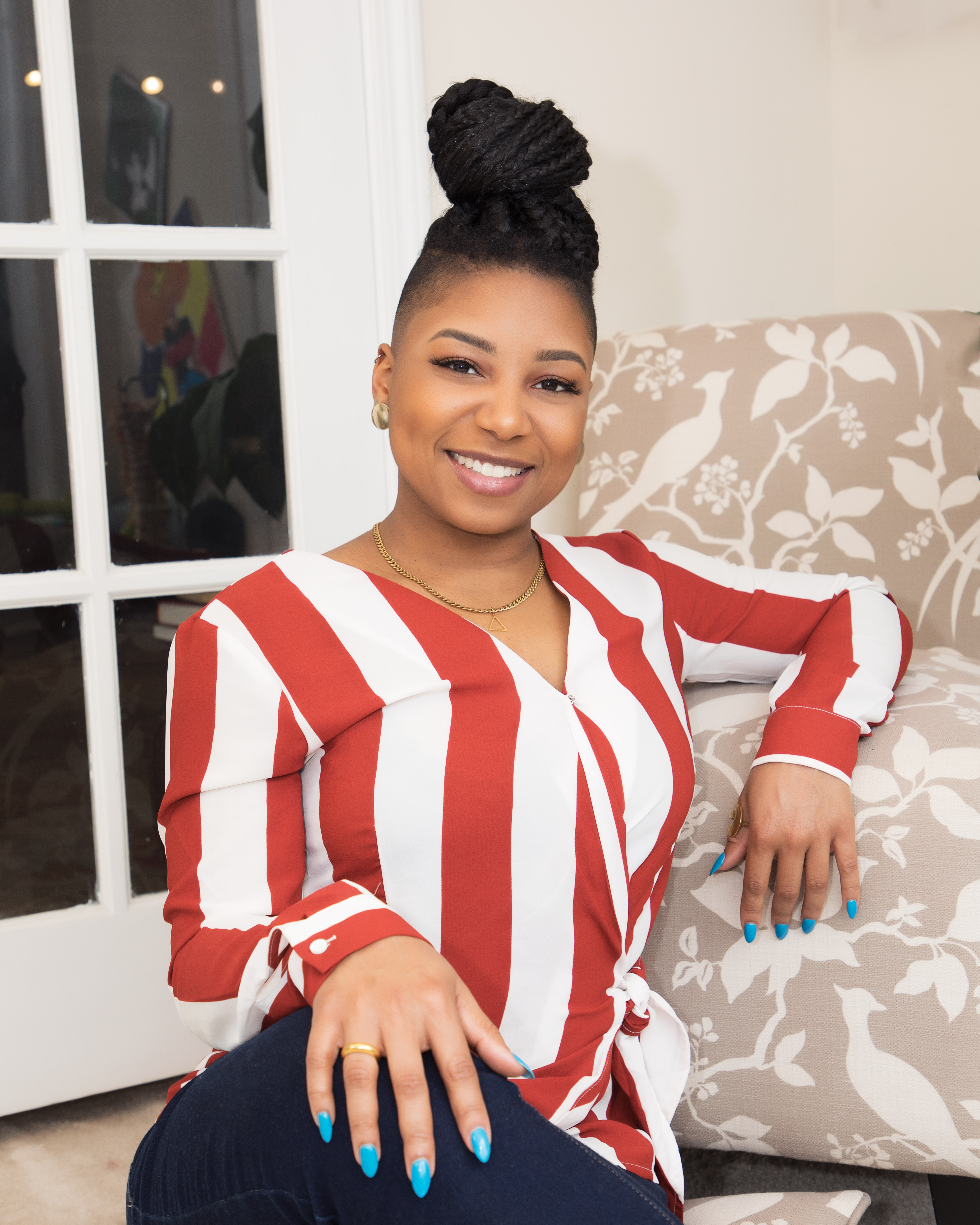 Alexzandra Ally Strickland, founder of Embodied Ally — smiling warmly